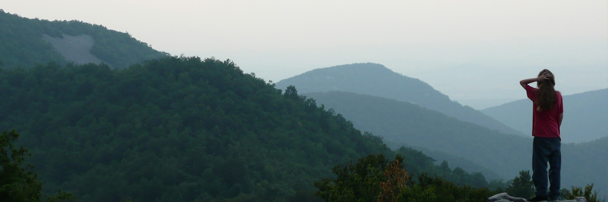 summer drama camp - camper stops to take in the view on a hike