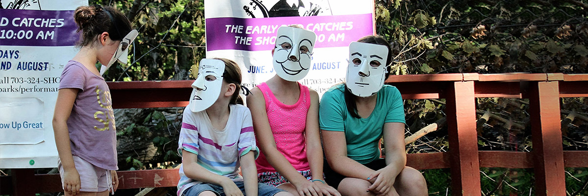elementary school actors play with masks
