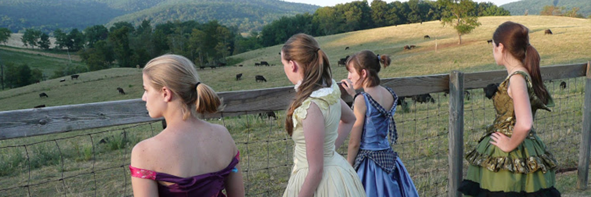high school actors stop on tour to look at the cows